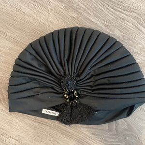 Tigerclub turban inspired headpiece with jewel detailing
